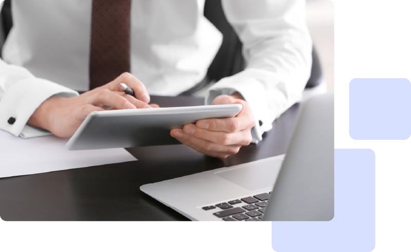 Businessman working on tablet and laptop