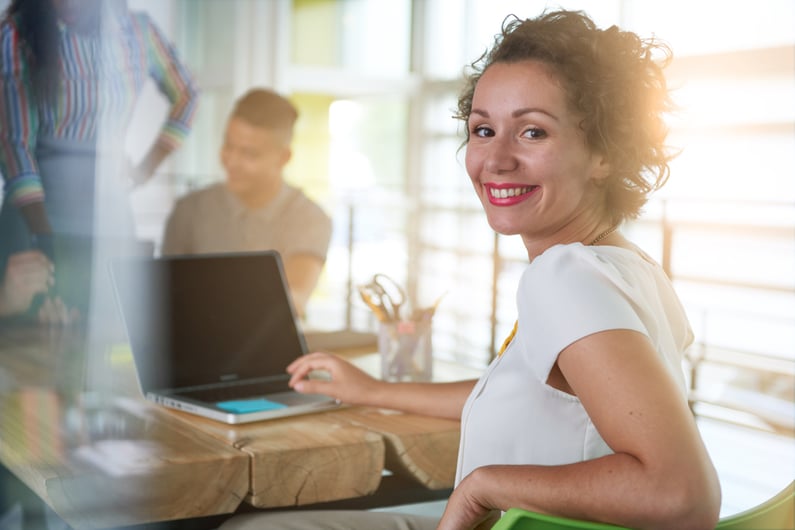 Image of a succesful casual business woman using laptop during meeting-2